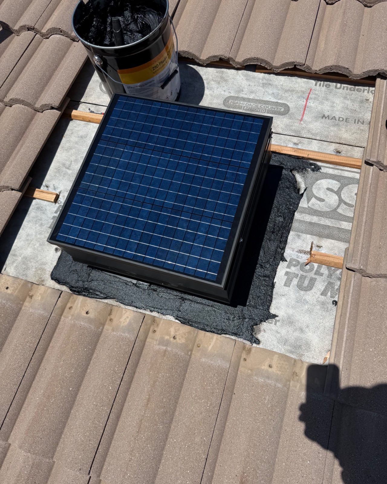 Three photos of us installing a solar attic fan