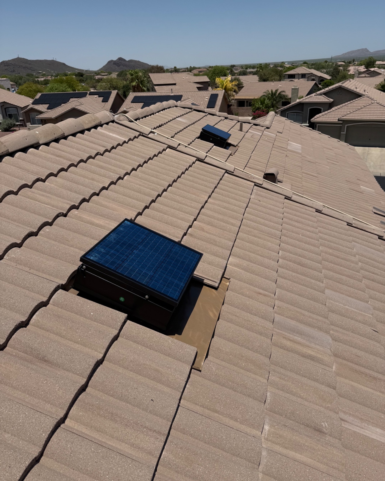 Three photos of us installing a solar attic fan